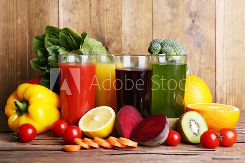 Fruit and vegetable juice in glasses and fresh fruits and 