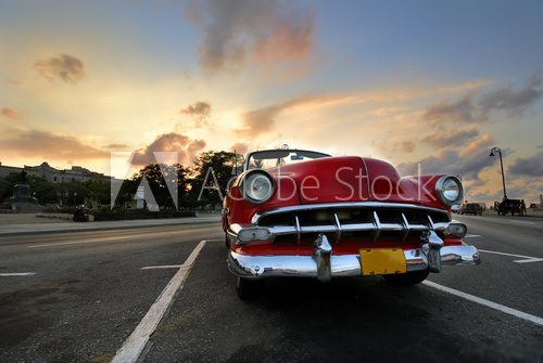 Red car in Havana sunset
