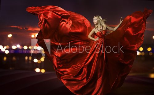 woman dancing in silk dress, artistic red blowing gown waving 