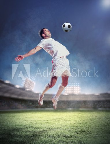 football player striking the ball 
