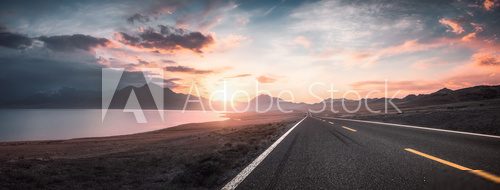 Lake and road  at sunset