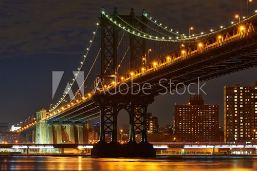 Manhattan Bridge and skyline view from Brooklyn at night 