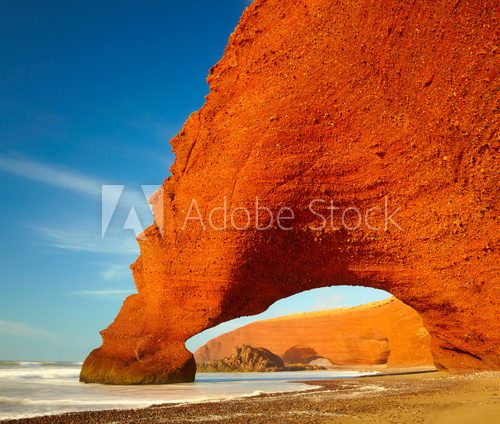Red archs on atlantic ocean coast. Marocco 