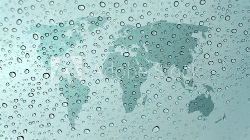 world map on glass with water drops 