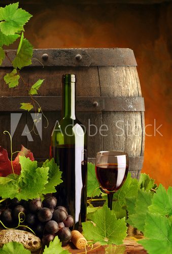 Red wine, grapevine and cask