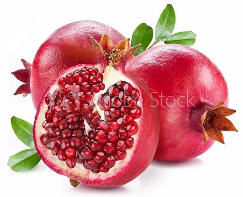 Ripe pomegranates with leaves.