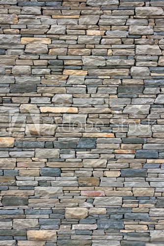 Ancient wall from slim granite brick. 