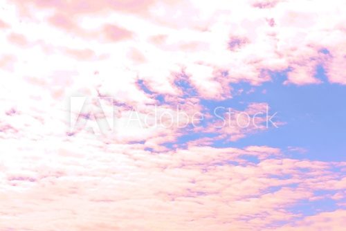 Blue sky background with pink clouds 