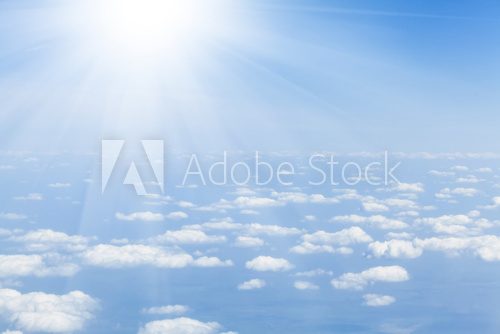 Blue sky with clouds and sun 