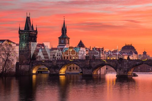 Charles Bridge in Prague with nice sunset sky in background, Czech Republic.