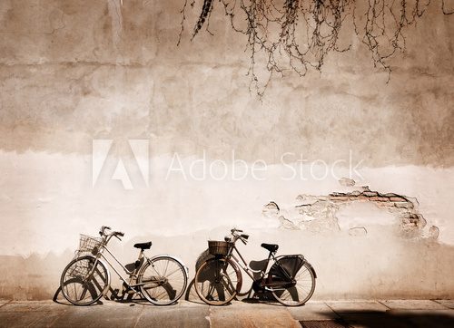 Italian old-style bicycles leaning against a wall