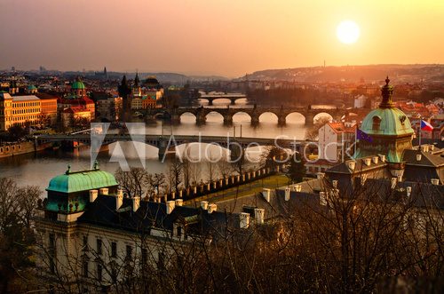 Panoramic view on Charles bridge and sunset Prague lights