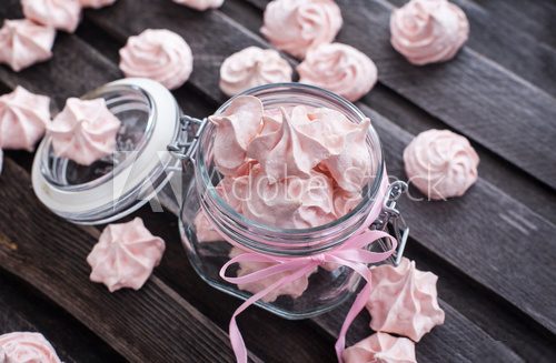 Pink meringues in a glass jar