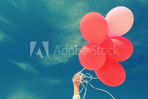 red balloons on the background of blue sky