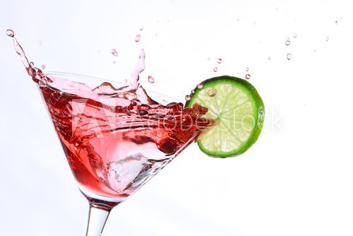 red cocktail with lime on white