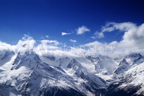 Snowy mountains at sun day 