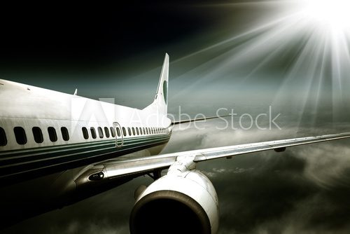 the airplane with the blue sky background