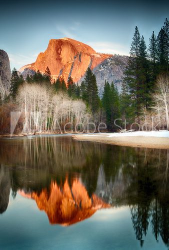 View of half dome reflected in the Merced river at Yosemite 