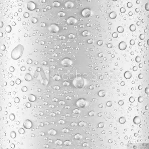 Water drops over gray glass background.