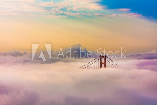 World Famous Golden Gate Bridge in thich Fog after Sunrise 