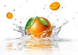 orange splashing into clear water