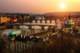 Panoramic view on Charles bridge and sunset Prague lights
