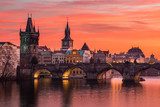 Charles Bridge in Prague with nice sunset sky in background, Czech Republic.