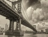 Cloudy evening in New York with Manhattan Bridge side view and c 