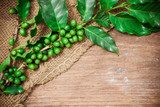 Coffee beans over wood background