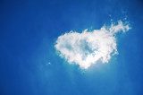 Heart shaped cloud in the blue sky 