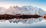 Incredible view of clear water and sky reflection on Chesery lake (Lac De Cheserys) in France Alps. Monte Bianco mountains range on background. Landscape photography, Chamonix.