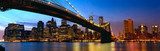 Manhattan panorama with Brooklyn Bridge at sunset in New York 
