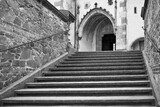 Moody black and white stairs and entrace to St. Vitus church in Cesky Krumlov without people during lockdown