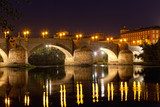 old stone bridge through the river Ebro in Zaragoza, Spain 