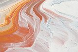 photography of abstract marbleized effect background. brown, orange, gold, gray and white creative colors. Beautiful paint