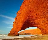 Red archs on atlantic ocean coast. Marocco 