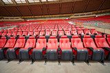 Rows of red armchairs at stadium 