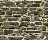 seamless black ashlar old stone wall texture