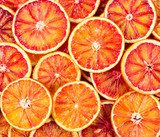 Seamless pattern with red Sicilian oranges.
