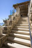 Stone stairway from hotel terrace to the beach 