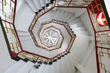Upward view of white spiral stairways 