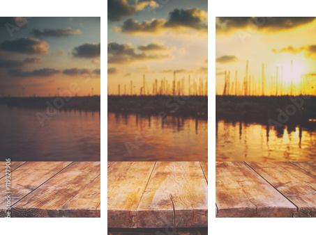 table in front of abstract blurred background of marine - Dreiteiliges Leinwandbild, Triptychon