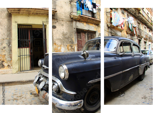 A classic old car is black color parked in front of the building - Dreiteiliges Leinwandbild, Triptychon