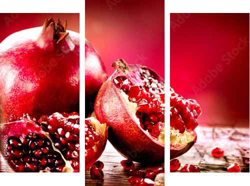 Pomegranates over Red Background. Organic Bio fruits - Dreiteiliges Leinwandbild, Triptychon