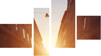 Empty cobblestone street in old town at sunset. - Vierteiliges Leinwandbild, Viertychon