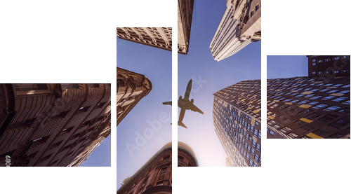 plane over highrise buildings - Vierteiliges Leinwandbild, Viertychon