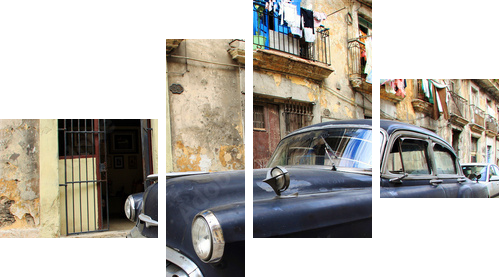 A classic old car is black color parked in front of the building - Vierteiliges Leinwandbild, Viertychon